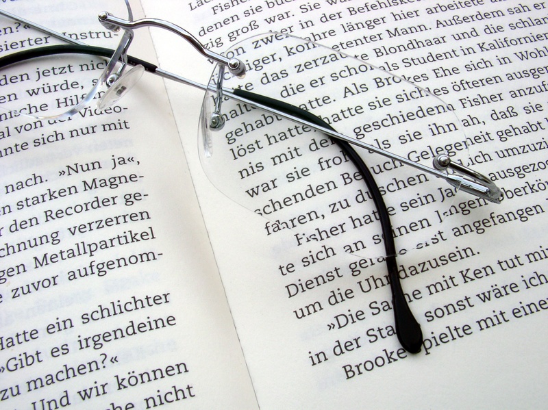 publication, book pages, personal accessory, belief, open, literature, book, read, paper, communication, bookworm, ring, close-up, leisure, glasses, pages