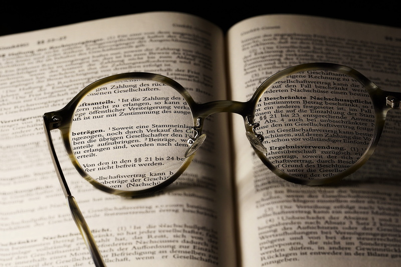 page, expertise, non-western script, two objects, study, text, detail, 5K, document, selective focus, no people, book pages, indoors, glasses, read, still life