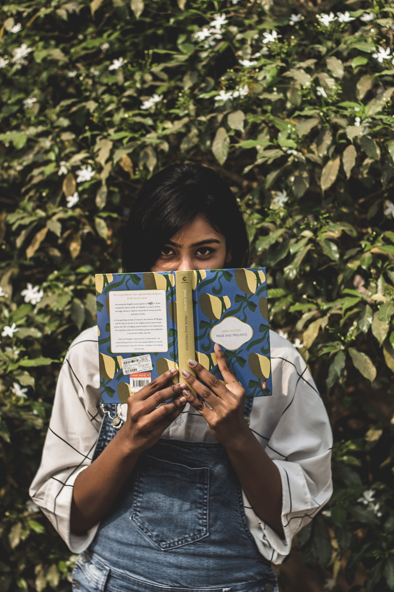 covering, front view, real people, day, front, hairstyle, outdoors, face, young women, 5K, teenager, leafed, girl, casual clothing, book, plant, one person