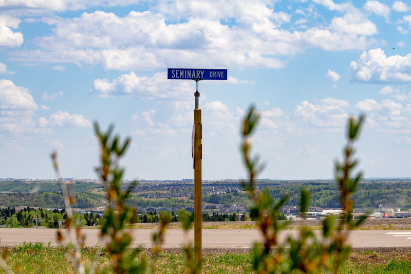 land, beauty in nature, cochran, clouds, western script, no people, outdoors, information sign, seminary, water, 5K, information, canada, outdoor, focus on background