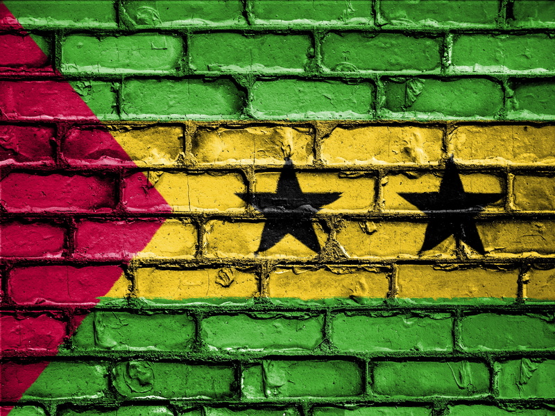 outdoors, pattern, flag, banner, sao tome and principe, patriotic, architecture, built structure, yellow, building exterior, focus on shadow, wall, symbol