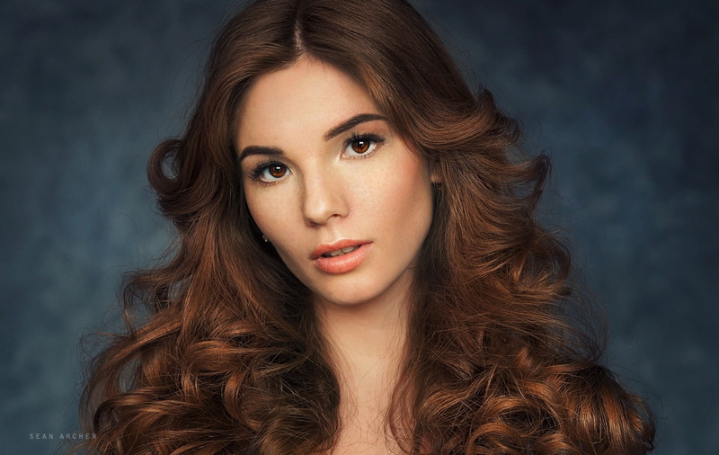 headshot, luxury, beautiful people, one person, glamour, Sean Archer, face, simple background, curly hair, long hair, looking at camera, looking at viewer