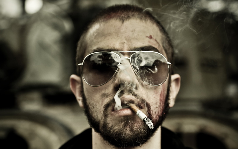 photography, cigarette, smoking - activity, focus on foreground, sunglasses, facial hair, activity, fashion, glasses, adult, close-up, portrait, aggression