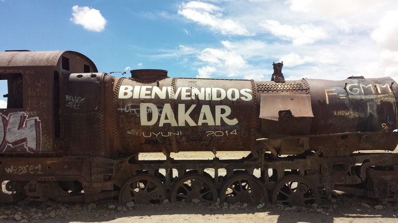 cloud - sky, nature, text, track, day, abandoned train, locomotive, western script, rail transportation, train - vehicle, shunting yard, steam train, the desert of uyuni