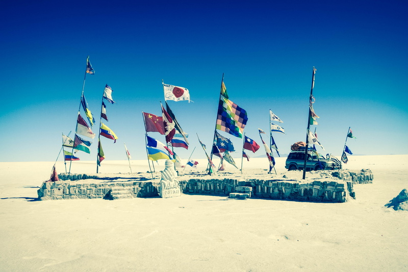 banner, transportation, sea, bolivia, variation, day, windy, beach, outdoors, vehilce, patriotism, flag, environment, flags, assorted, land, vehicle, uyuni salt flats