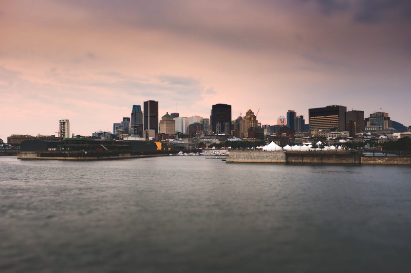 outdoors, architecture, urban skyline, canada, built structure, no people, sunset, city, office building exterior, cité du havre, golden hour, sea, skyscraper