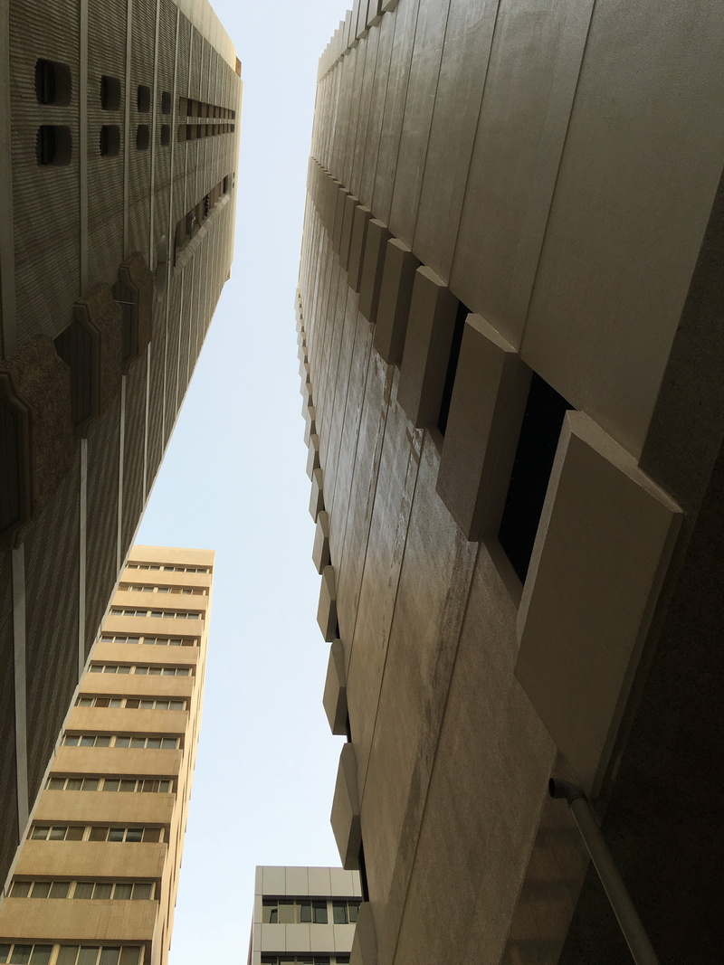 building exterior, tower, no people, low angle view, clear sky, office, sky, tall - high, crater, sunlight, financial district, office building exterior