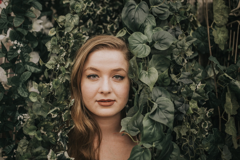 headshot, plant, human, growth, lifestyles, leaf, graphic design, leaves, vine, face, looking at camera, nature, flora, real people, leisure activity, art