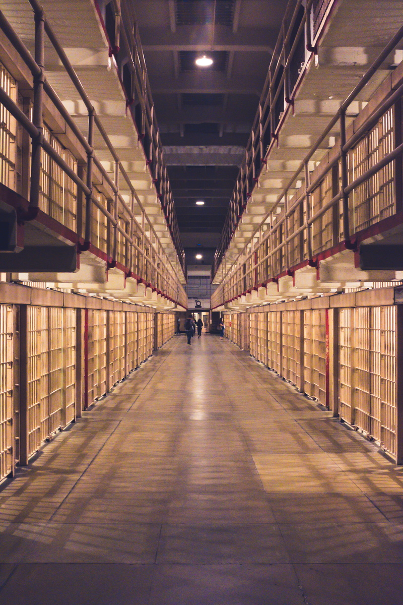 prison, indoors, building, shelf, incidental people, arcade, lighting equipment, the way forward, built structure, alcatraz, real people, education, publication