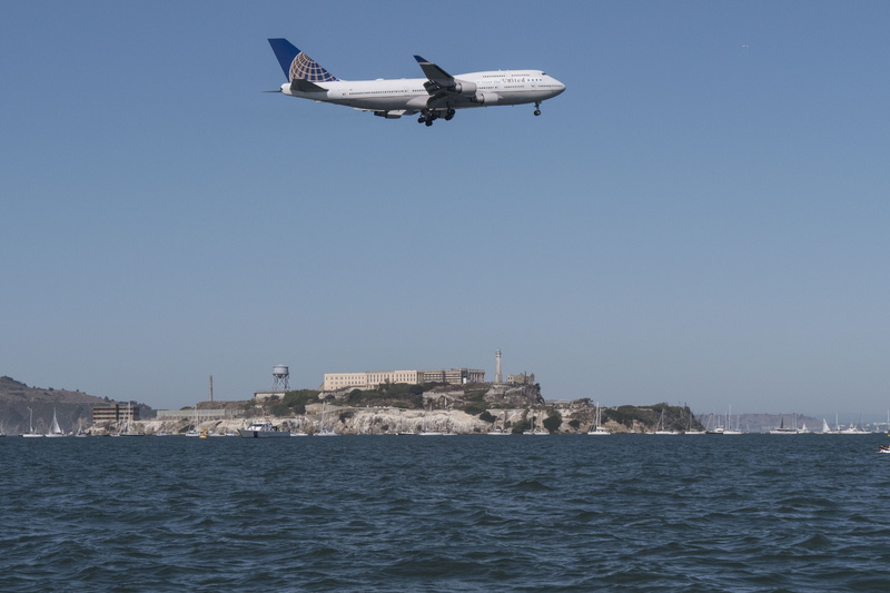 day, island, mid-air, flying, motion, no people, california, bay, water, architecture, nature, sky, plane, clear sky, san francisco, outdoors, air vehicle