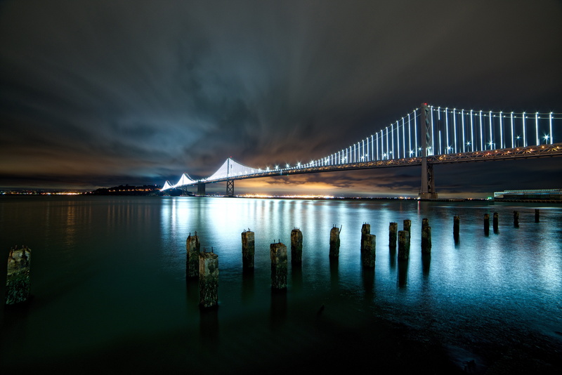 bay, sky, wooden post, sea, illuminated, ocean, bridge - man made structure, no people, long exposure, transportation, bridge, water, suspension bridge