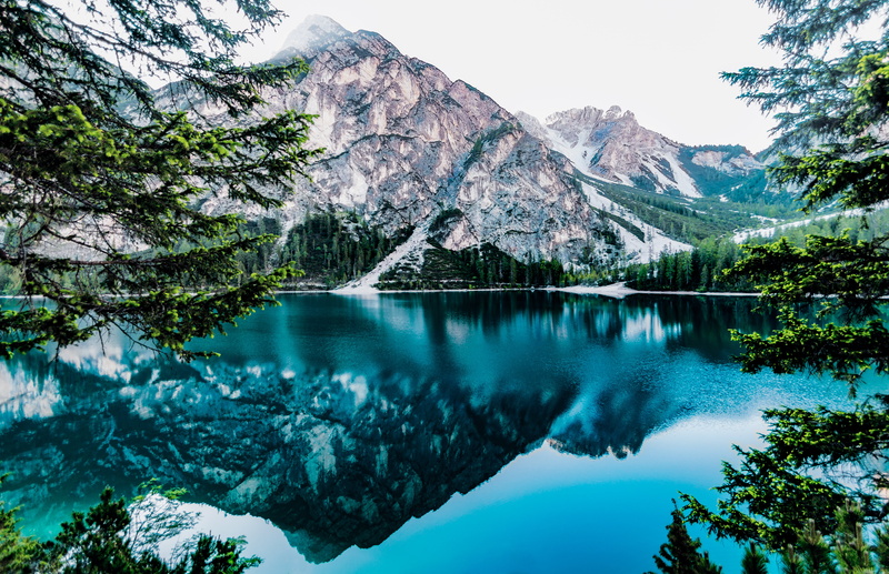 winter, reflection, mountain range, pine tree, water, cold temperature, tree, landscape, sky, day, mountains, trees, tranquil scene, snowcapped mountain