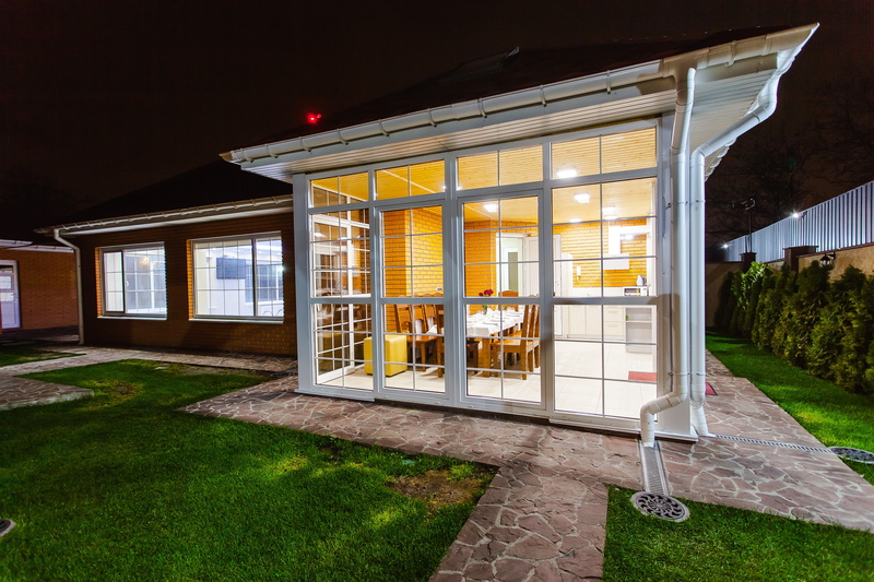 glass - material, nature, lights, illuminated, front stoop, turned, residential district, outdoors, modern, grass, front or back yard, plant, veranda, kitchen