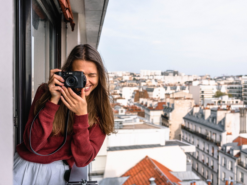 cityscape, tourism, windows, architecture, veranda, portrait, sightseeing, digital camera, young adult, woman, exterior, built structure, hairstyle, daylight