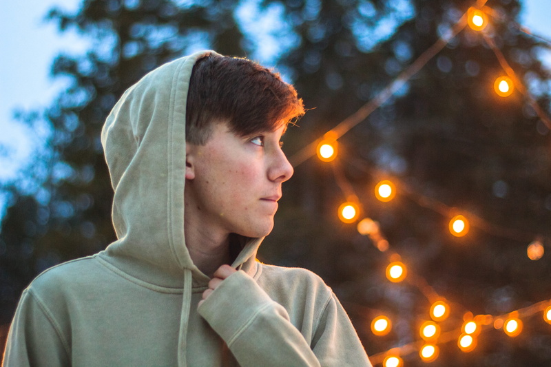 casual clothing, boy, standing, cool tones, wandering, headshot, tree, young adult, portrait, adolescence, bokeh, child, contemplation, teenager, warm tones
