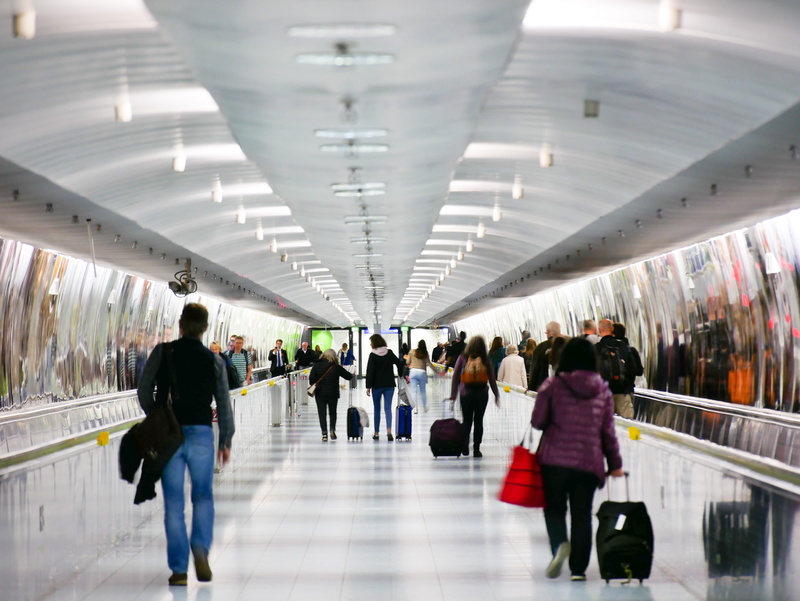 terminal, ceiling, men, airport, apparel, group of people, travel, shoe, walking, pants, crowd, airport terminal, walkway, architecture, illuminated, adult