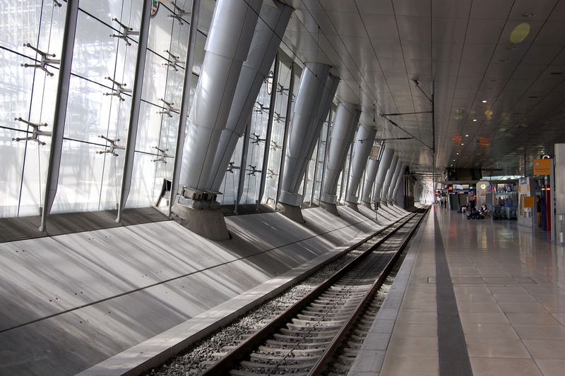 architecture, railroad track, indoors, day, incidental people, mode of transportation, window, modern, direction, flooring, travel, 2K, rail transportation