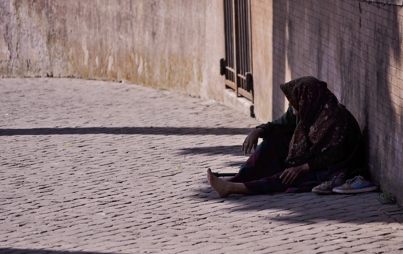 brown, footpath, elderly, street, one person, adult, leaning, profile view, casual clothing, wall, day, concrete, adults only, architecture, people, built structure