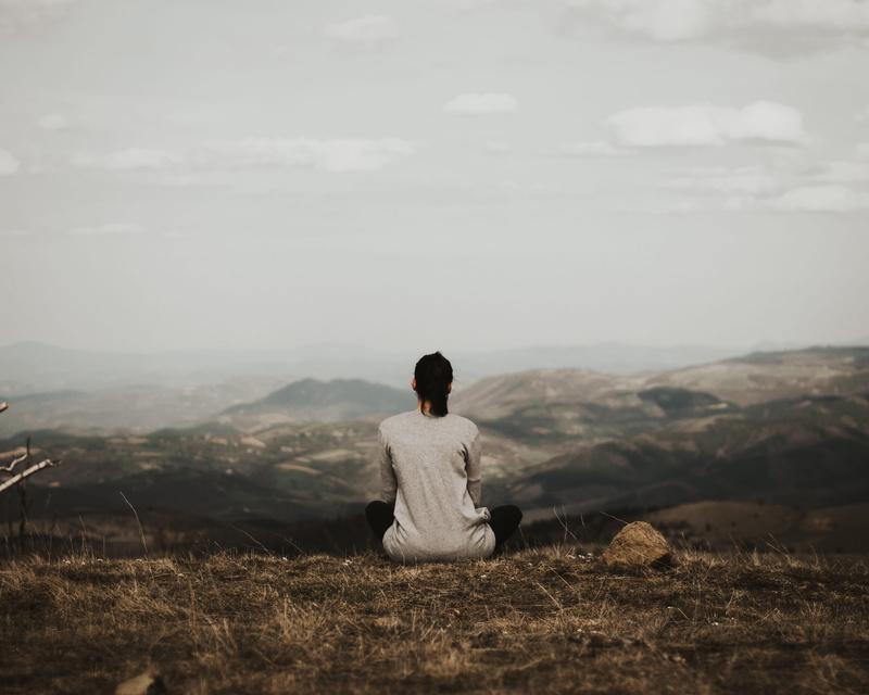 girl, non-urban scene, daytime, cloud, scenics - nature, hairstyle, fashion, cliff, sky, view, tranquility, woman, mountain range, real people, solitude