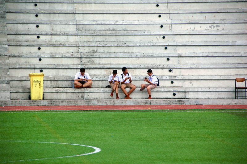 young adult, wearing, sat, 2K, soccer, adult, sitting, sports clothing, boys, phone, women, step, athlete, clothing, football, grass, real people, field