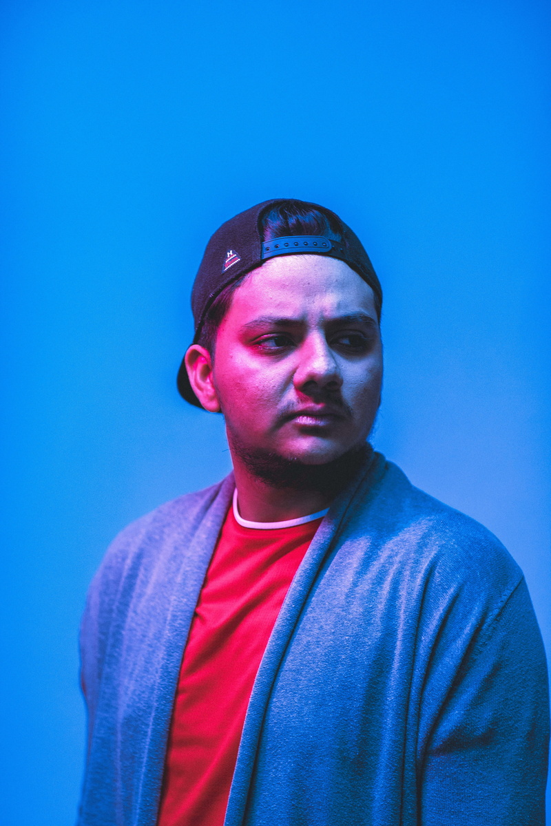 pose, standing, young men, blue background, youth, looking at camera, wear, person, looking, bad, young adult, cap, cardigan, man, young, sweatshirt, urban
