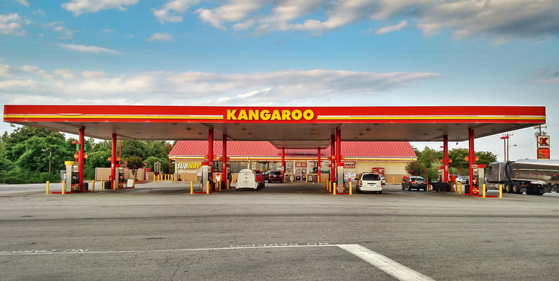 transportation, road, kangaroo, city, architecture, station, street, panorama, motor vehicle, consumerism, gas, retail, text, gas station, sign, business