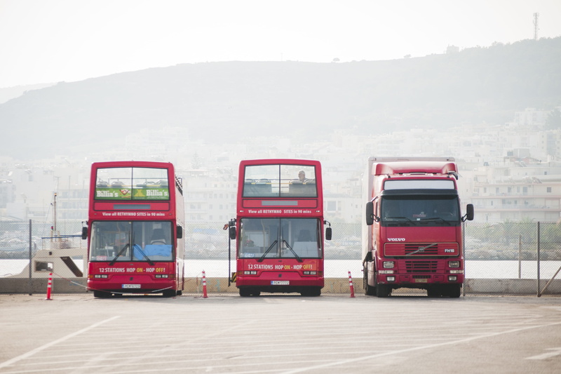 person, day, people, cars, double decker bus, commercial land vehicle, hydrant, nature, fire truck, tour bus, on the move, outdoors, red, truck, bus, bus stop