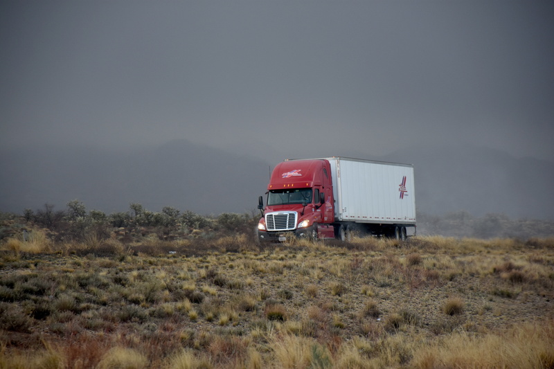 semi, driving, white, sky, daytime, motor vehicle, commercial land vehicle, landscape, mode of transportation, uSA, day, outdoors, trucking, semi-Truck