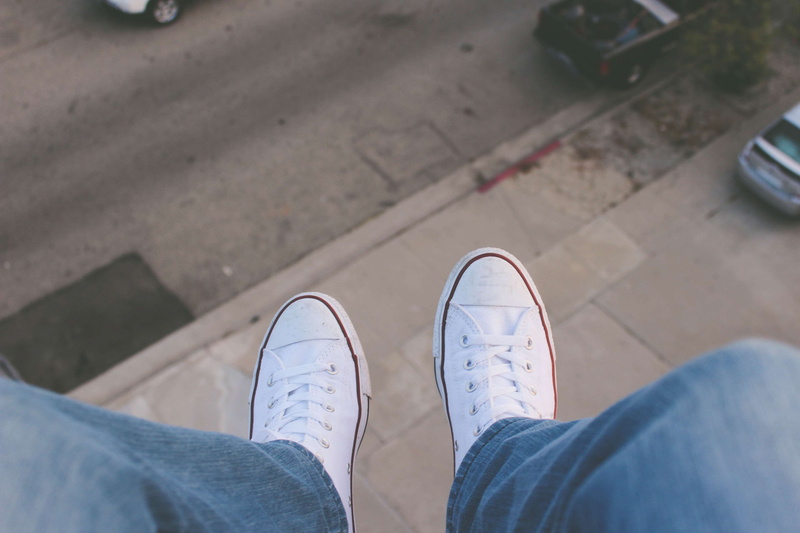 white, converse all star, human leg, outdoors, jeans, day, lifestyles, street, adult, low section, city, body part, men, personal perspective, human foot