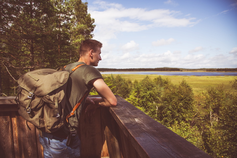 leisure activity, green, trees, water, 5K, young adult, boy, outdoors, male, fence, leaning, one person, railing, surrounded, real people, nature, backpack
