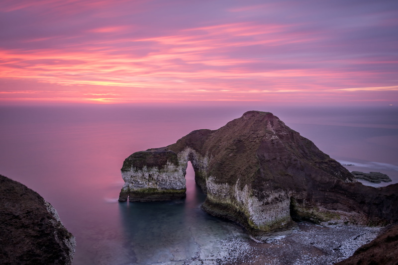 seashore, cliff, natural, light, island, beach, mountain, pink color, travel, dawn, sun, sky, colour, dusk, clouds, rock, rock - object, coast, purple