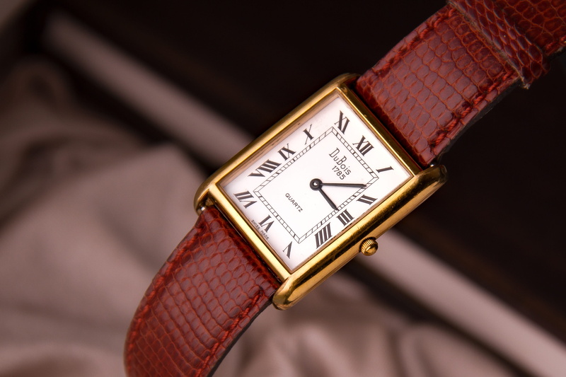 finance, swiss watch, leather, antique, indoors, punctuality, selective focus, focus on foreground, studio shot, close-up, luxury, wrist watch, no people