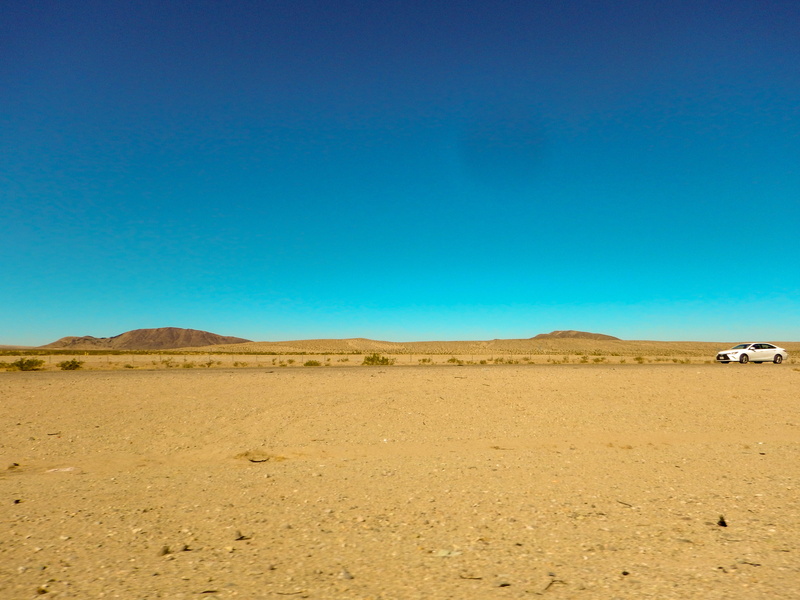 copy space, tranquil scene, outdoors, desert, land, tranquility, climate, landscape, no people, blue, non-urban scene, arid climate, environment, day, mojave desert