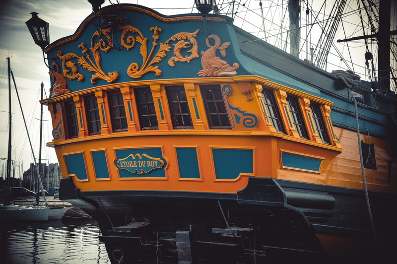 pirates, transportation, nature, outdoors, sea, day, no people, western script, yellow, etoile du roy, ship, communication, building exterior, arts culture and entertainment