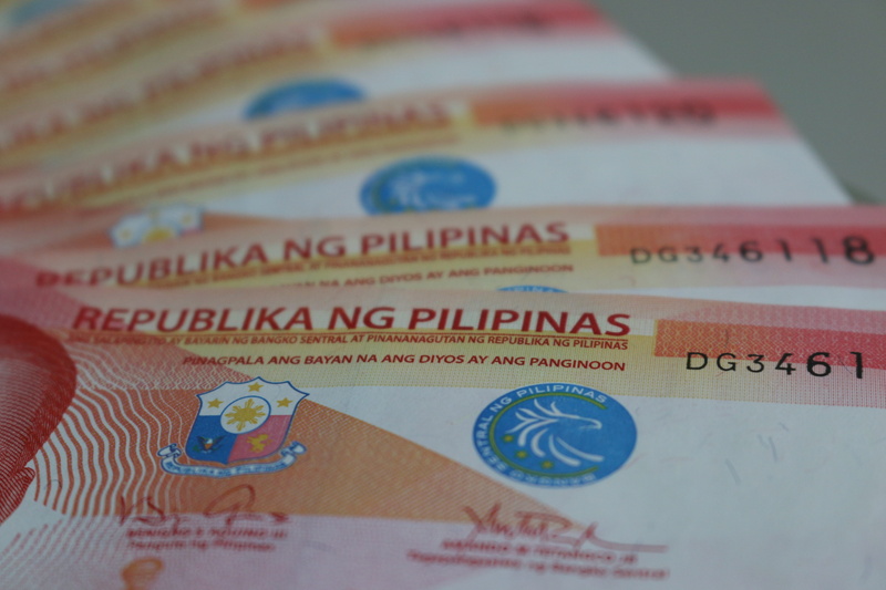 5K, number, no people, Peso, indoors, selective focus, studio shot, still life, high angle view, western script, red, paper currency, day, backgrounds