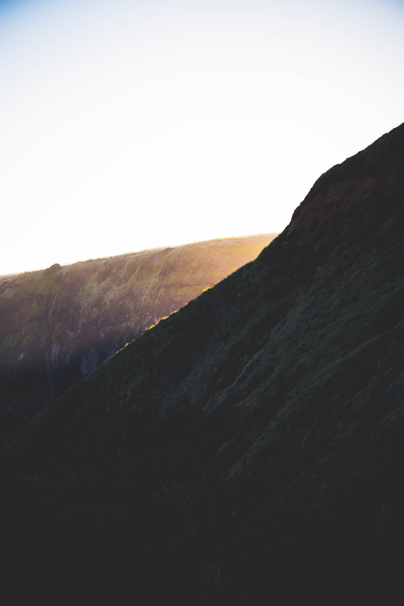land, hill, day, sky, outdoors, cliff, lock screen background, sunrise, mountain peak, mountain range, non-urban scene, tranquil scene, covering