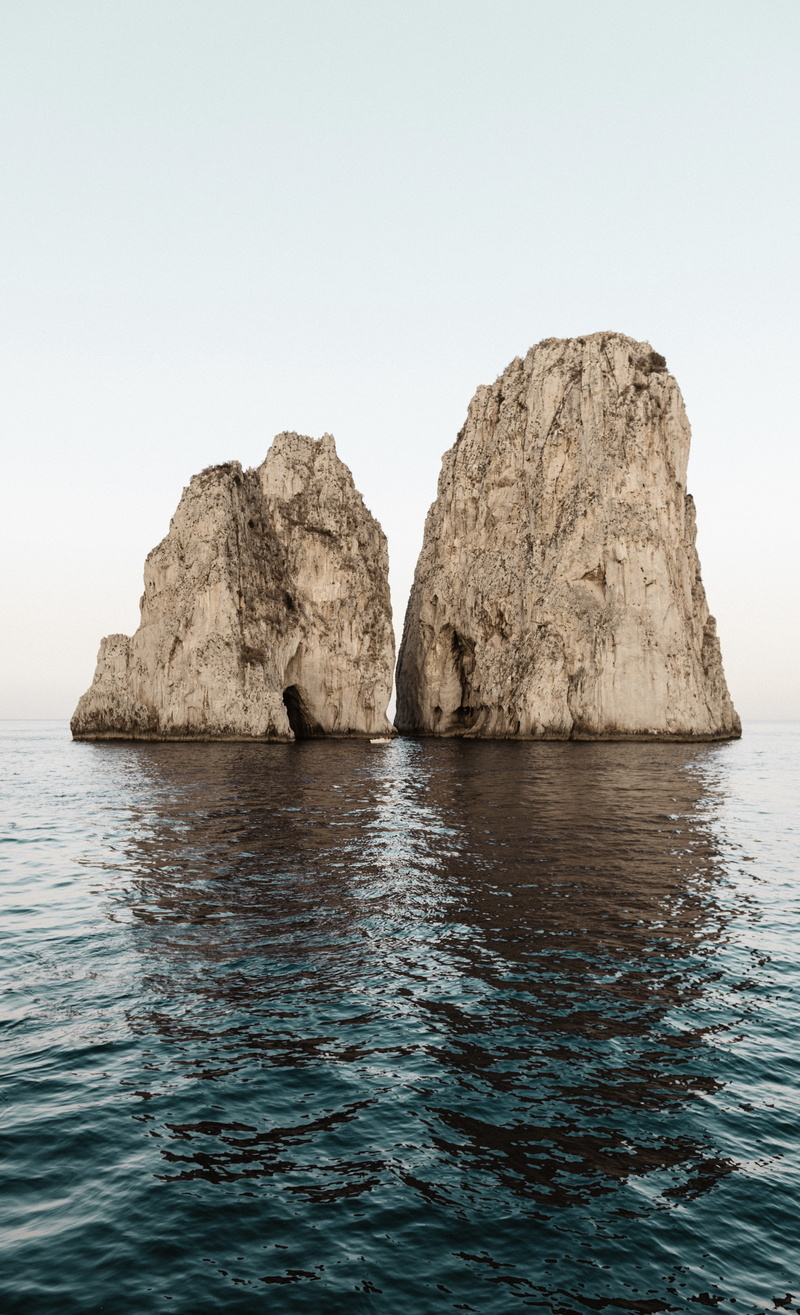 two, rock - object, iphone, rock formation, day, copy space, outdoors, formations, clear sky, solid, idyllic, lock screen background, sky, sea