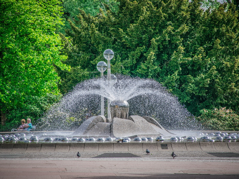 flowing water, built structure, incidental people, tree, plant, motion, human representation, nature, gushing, fountain, outdoors, architecture, spraying