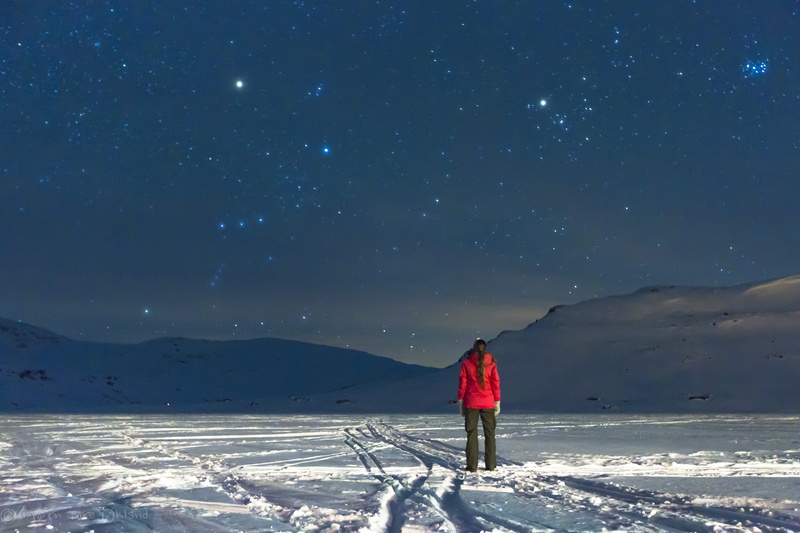 snow, outdoors, rear view, wilderness, 5K, standing, covering, lifestyles, stargazing, field, night sky, mountain, one person, mountain range, non-urban scene