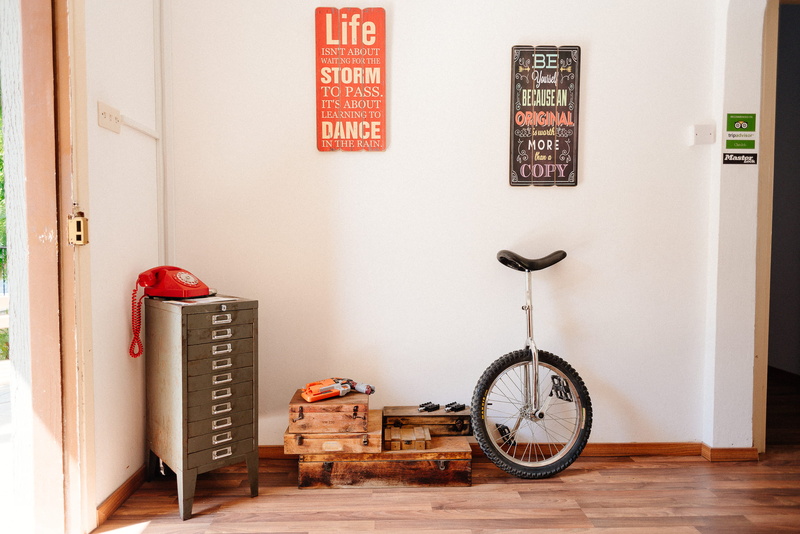 no people, floor, white, bike, silver, transportation, wood - material, decor, mode of transportation, text, wall, behind, black, bicycle, architecture