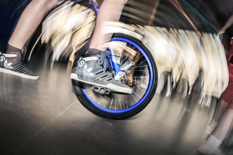 one person, transportation, blurred motion, sport, bicycle, human body part, unicycle, men, motion, speed, wheel, factory, low section, mode of transportation