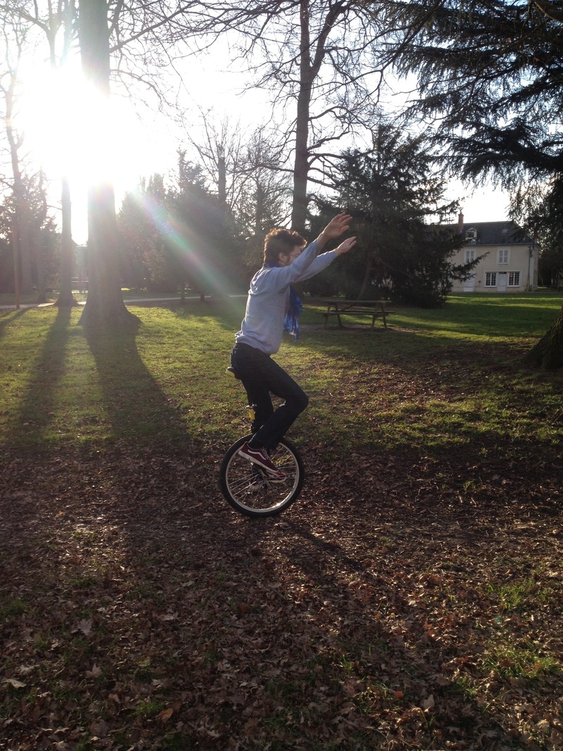 green, sunlight, sunny, field, equilibrium, bicycle, casual clothing, lifestyles, vaux-le-pénil, riding, grass, lens flare, one person, transportation