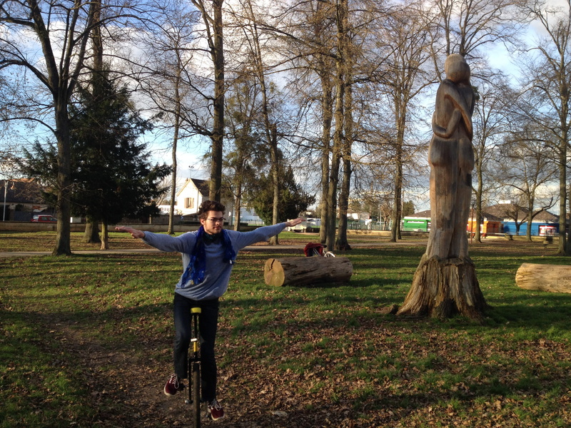 full length, casual clothing, land, 2K, square, outdoors, tree, sculpture, grass, men, plant, vaux-le-pénil, park - man made space, unicycle, nature, one person
