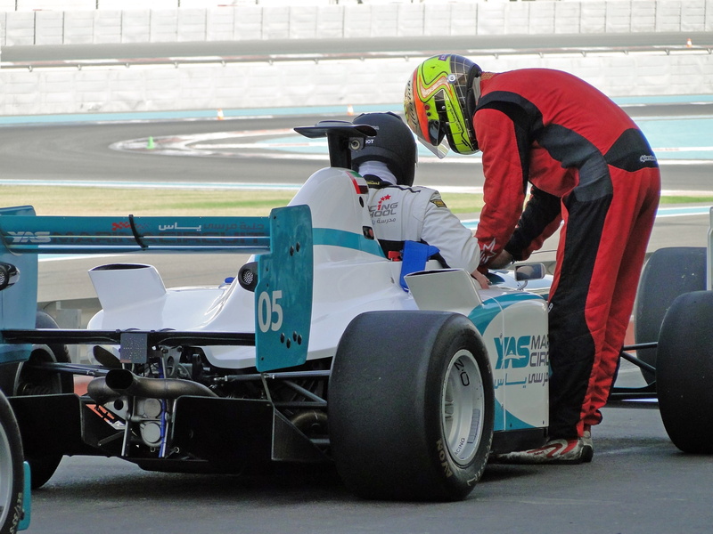 mode of transportation, car, occupation, security, racecar, day, wheel, headwear, helmet, transportation, competition, formula, 2K, real people, racing