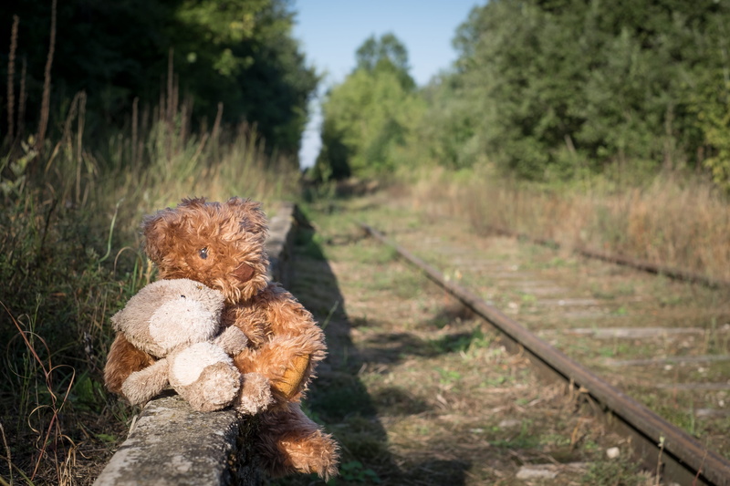 old, stuffed toy, sitting, railroad track, couple, vintage, romantic, innocence, outdoors, day, trip, no people, care, help, track, fluffy, emotion, transportation