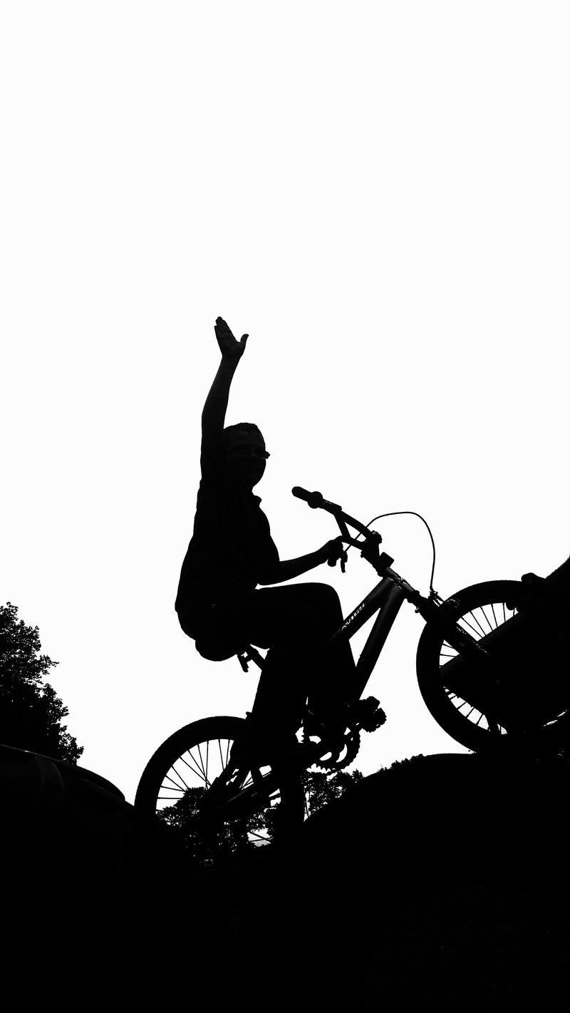 copy space, silhouette, leisure activity, biking, riding, mode of transportation, human arm, low angle view, transportation, lifestyles, activity, men