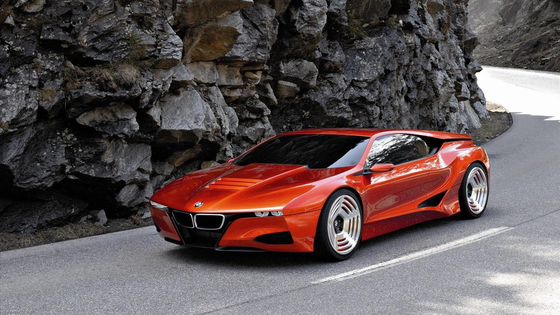 rock - object, symbol, transportation, red, outdoors, nature, land vehicle, sports car, tree, rough, luxury, bmw, day, m1, rock, no people, solid, mode of transportation