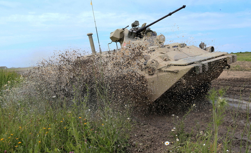 one person, day, camouflage clothing, outdoors, armored tank, men, land, transportation, government, btr 80, military, mode of transportation, water, real people