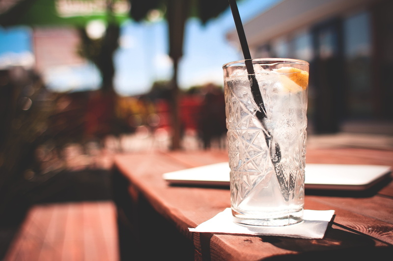 fresh, ice cube, glass, drinking straw, cold, food, outdoors, still life, food and drink, cocktail, sunlight, wood - material, cup, lemon, apple, glass - material
