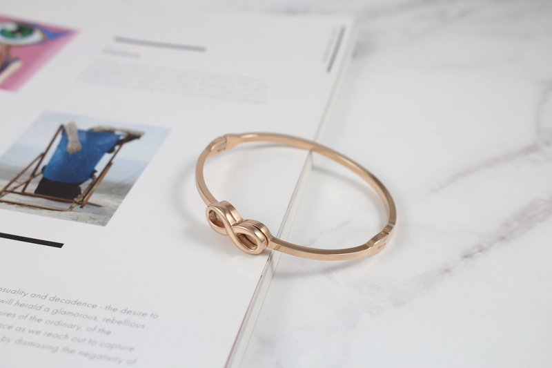 bracelet, education, nail, beautiful port, paper, beauty, table, metal, unlimited, hand, still life, high angle view, communication, indoors, book, outfit